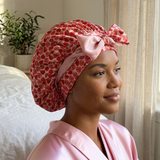 Reversible strawberry print and blush silk bonnet made from 100% mulberry silk, breathable, double-layer hair protection for sleep.
