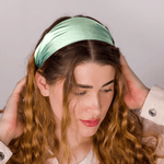 Model with wavy hair wearing Aqua Blue Pure Mulberry Silk Headband – elegant and hair-protective
