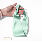 OEKO-TEX certified Aqua Blue 100% Mulberry Silk Headband held in hand – safe for skin and eco-friendly
